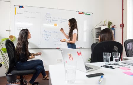 Woman-in-an-office-setting-explaining-personal-branding-strategy